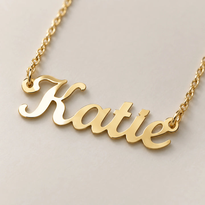 Close-up of the gold Name necklace in cursive lettering