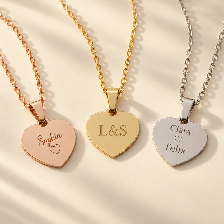 Three Love heart pendants in rose gold, gold and silver with engraved names