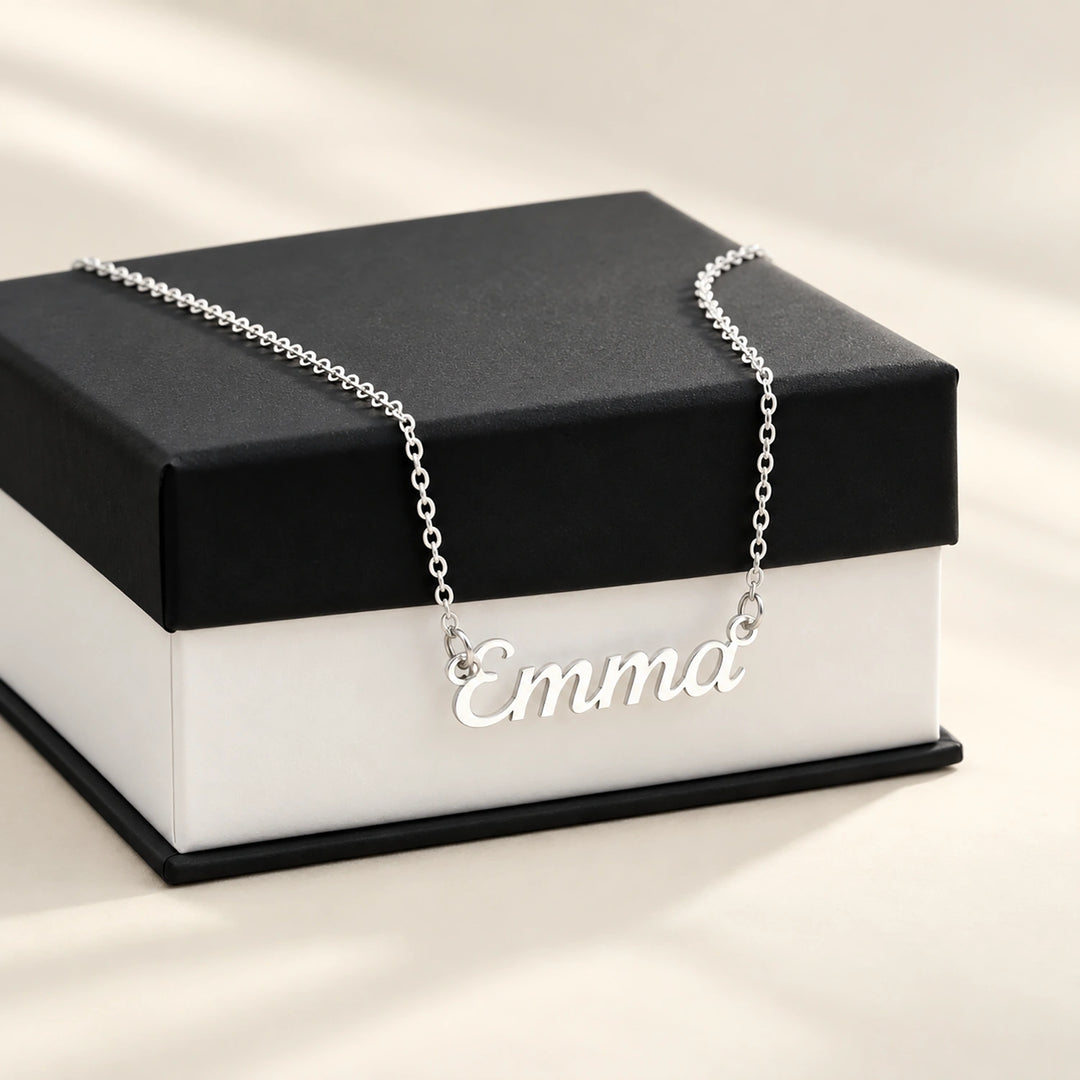 Silver Name necklace on a black and white gift box