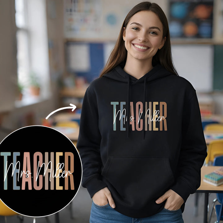 Personalized Hoodie "Teacher" as a gift for teachers: black hoodie with colorful TEACHER lettering and name in script – famwalls