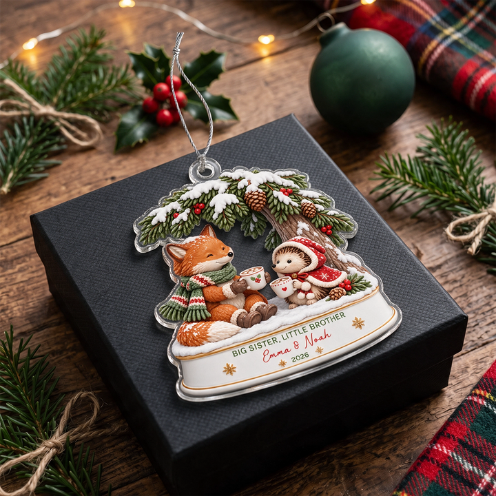 Fox and Hedgehog sibling ornament with Big Sister, Little Brother on a black gift box