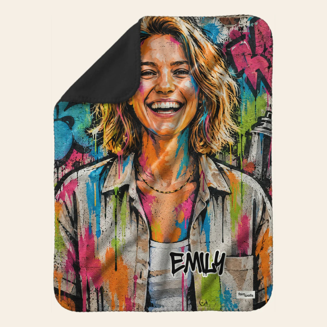Fleece blanket with a smiling woman in colorful street graffiti style and the name Emily