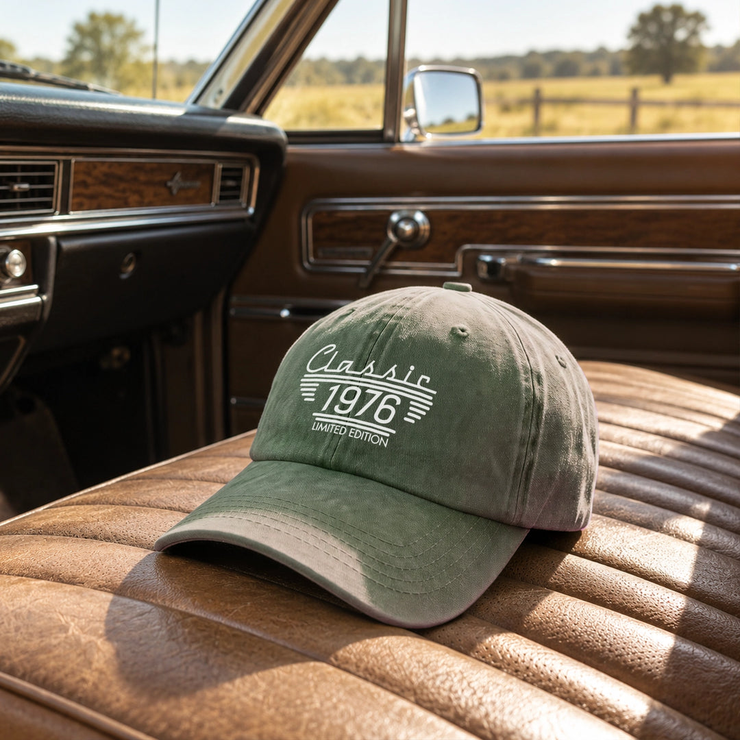 Green vintage cap with Classic 1976 Limited Edition print on a vintage car seat