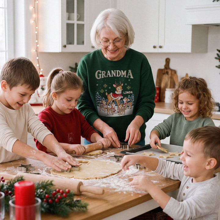 Grandma baking Christmas cookies with her grandkids in a green personalized GRANDMA reindeer sweatshirt