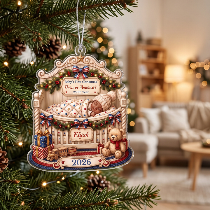 Baby’s First Christmas ornament with the name Elijah on a Christmas tree in a cozy living room