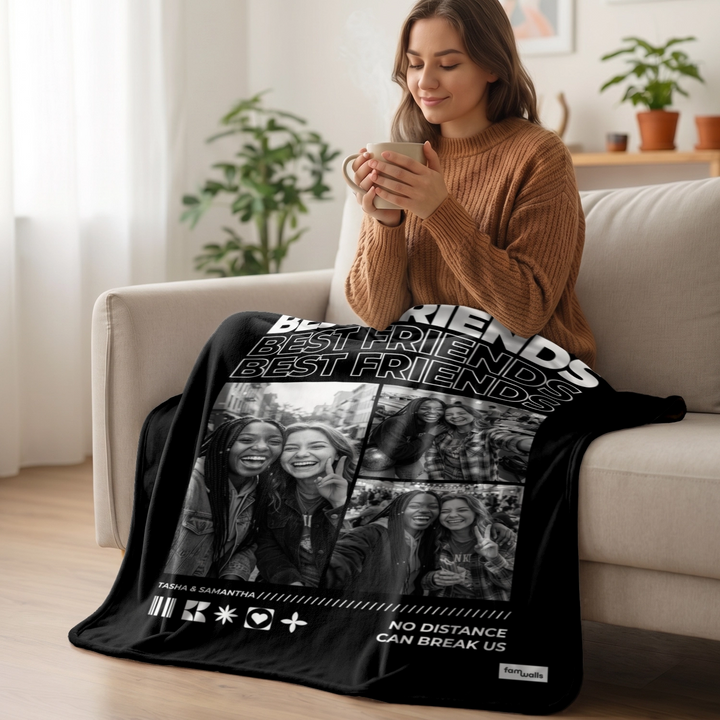 Woman relaxing on the sofa under a black Best Friends photo blanket