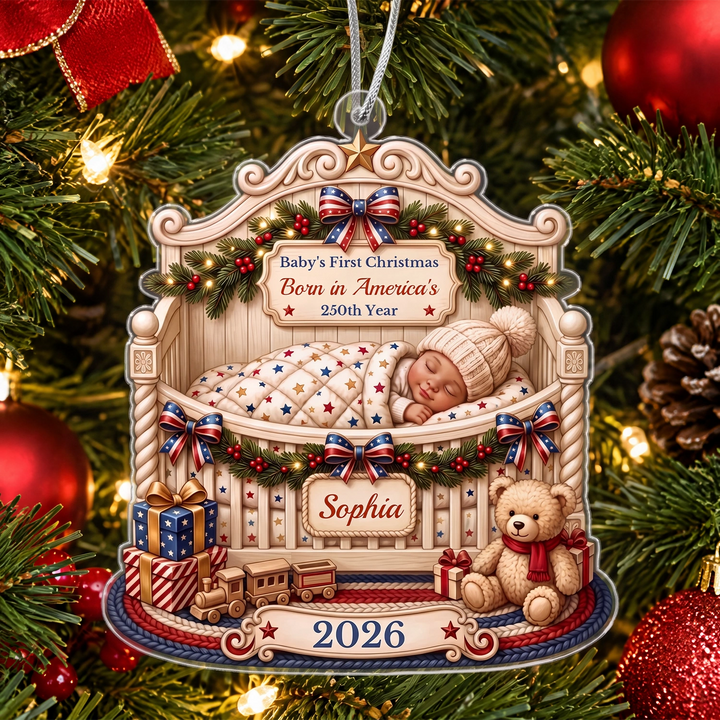 Baby’s First Christmas ornament with the name Sophia between red Christmas baubles