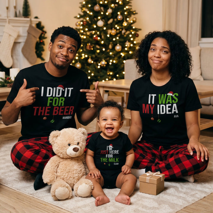 Couple and baby in black Christmas shirts with “I did it for the beer”, “It was my idea” and “I’m just here for the milk”