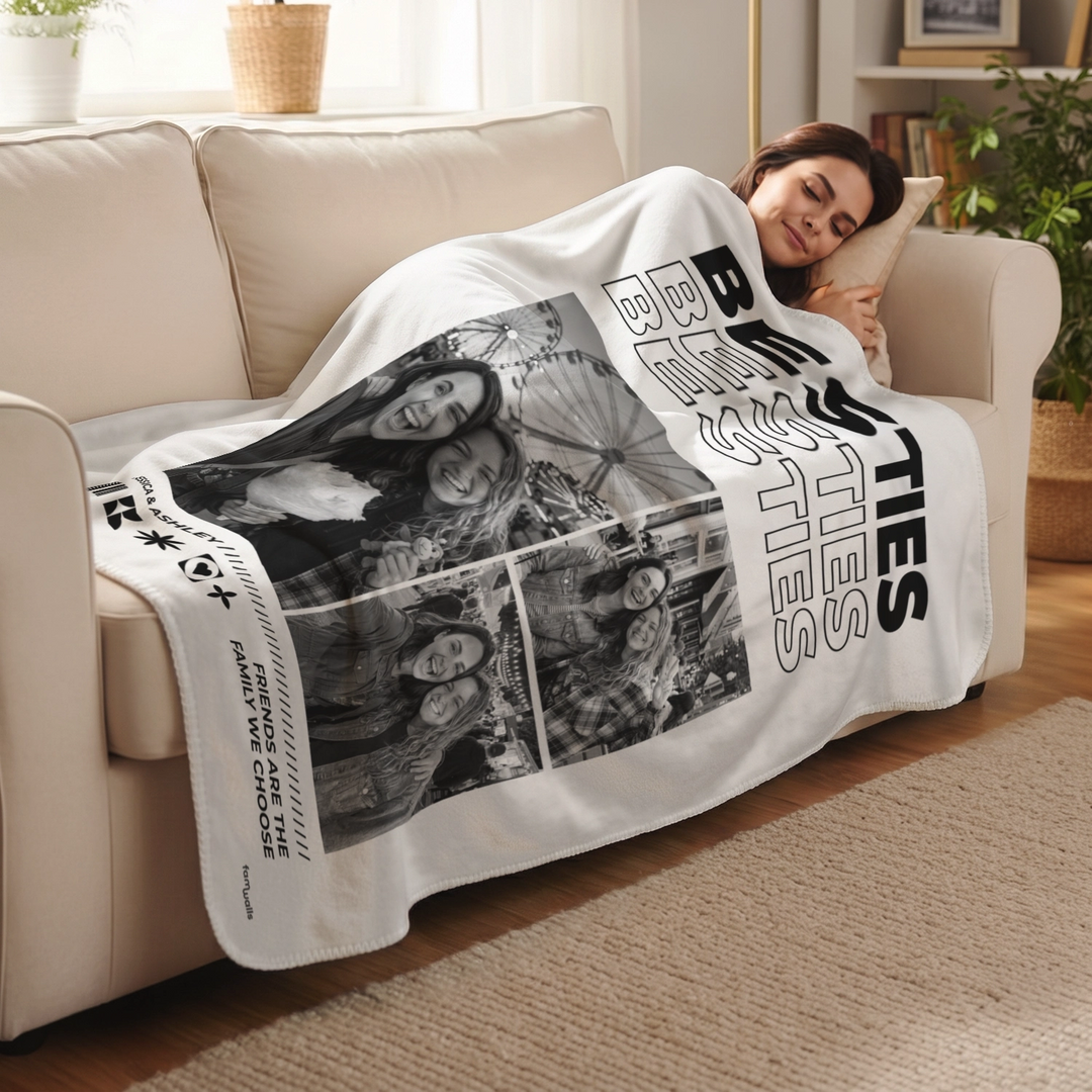 Woman lying on the sofa under a white Besties photo blanket