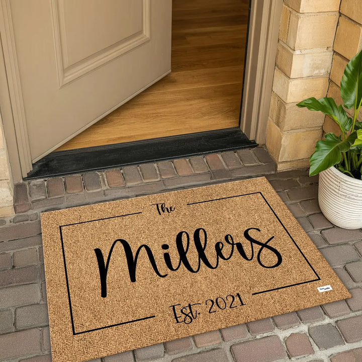 Family name doormat at an open front door