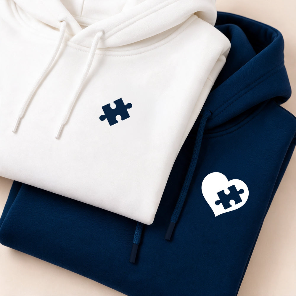 White and navy hoodies with matching puzzle piece and heart print