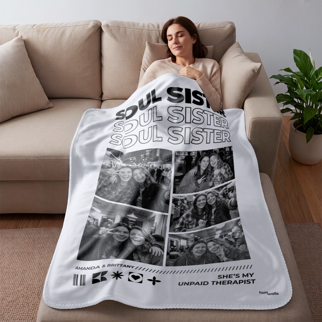 Woman resting on the sofa under a white Soul Sisters photo blanket