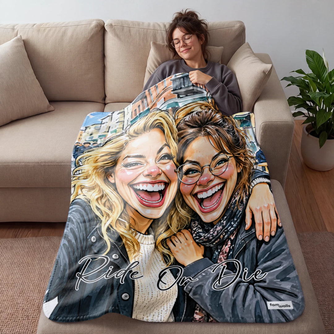 Woman cozy on the couch under a Ride Or Die sketch blanket
