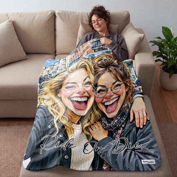 Woman cozy on the couch under a Ride Or Die sketch blanket