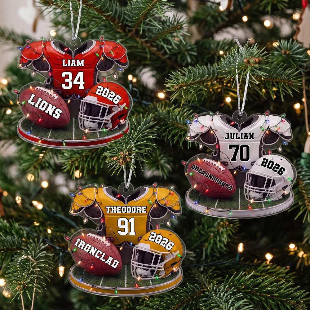 Three Football ornaments in red, yellow and white on a Christmas tree