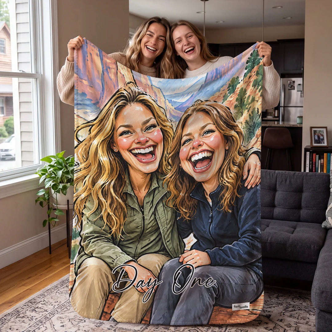 Two friends holding up their Day One sketch blanket in the living room